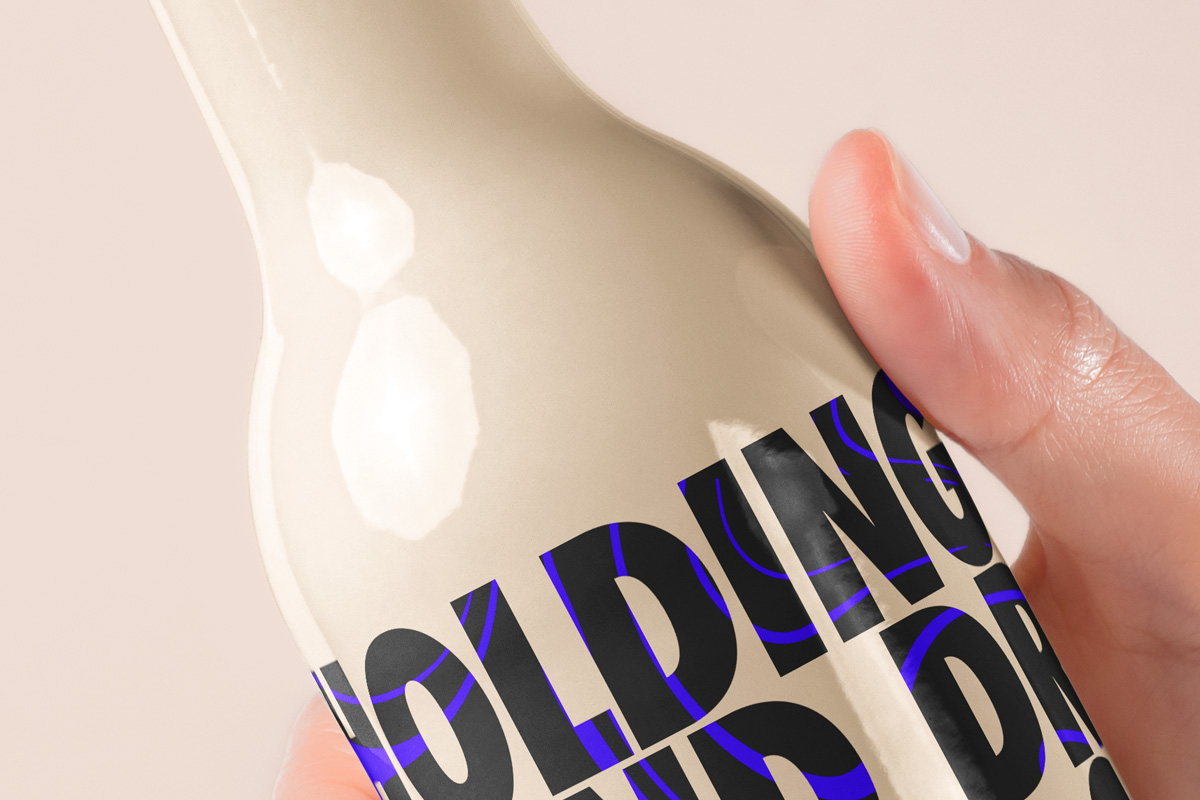 Download Hand Holding Psd Bottle Mockup | Psd Mock Up Templates | Pixeden